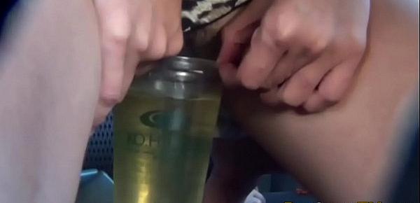  Asian fills cup with piss